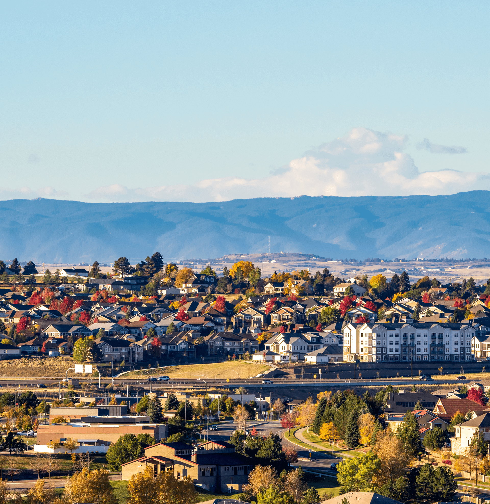 Houses and mountains under clear sky