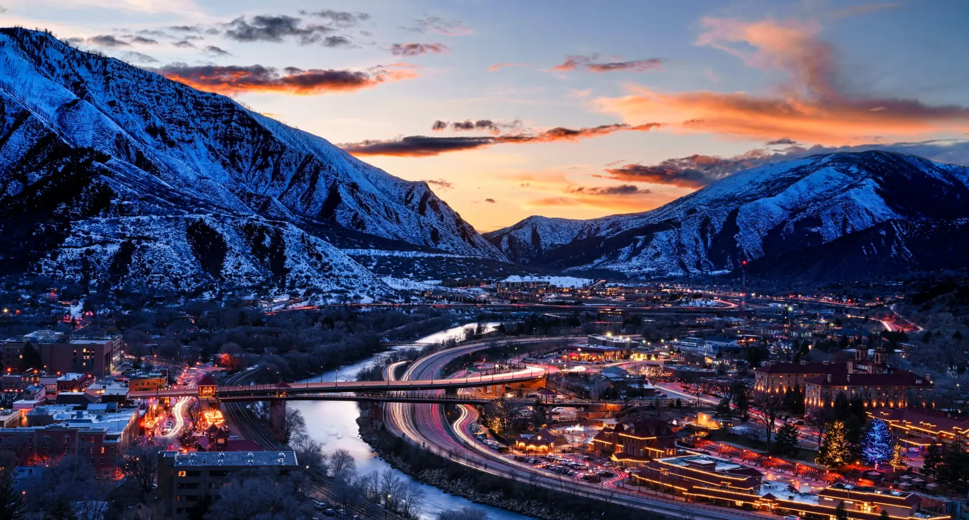 Snowy mountains and illuminated townscape